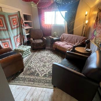 Cozy lounge seating with warm lamplight