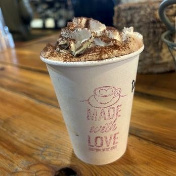 Iced caramel drink with cold foam
